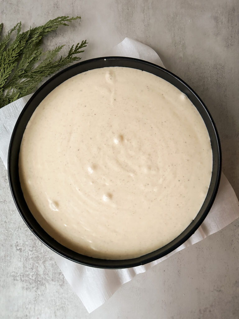 Pour cheesecake filling over cooled crust