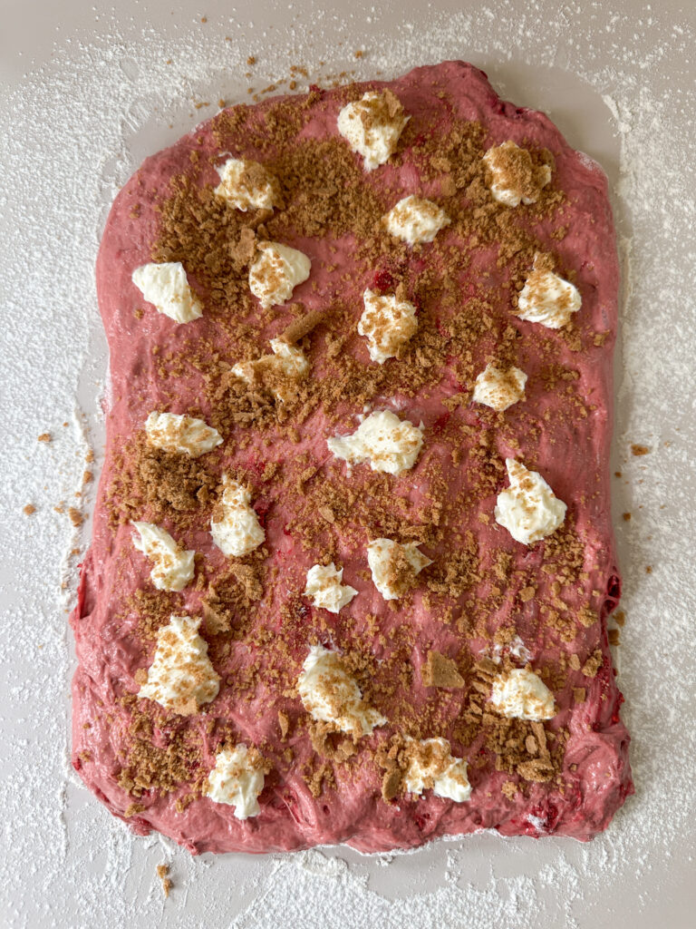 Sprinkle graham cracker pieces all over the dough