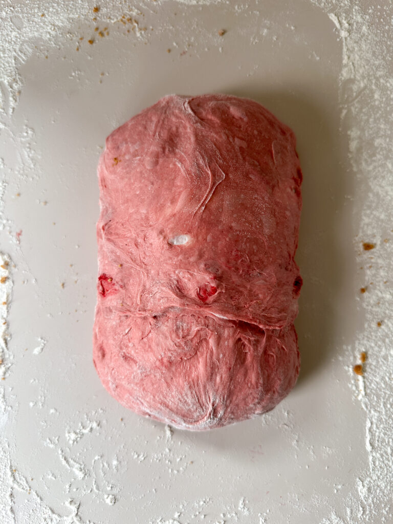 Fold the ends over the center to create an oval, and pinch the seams together