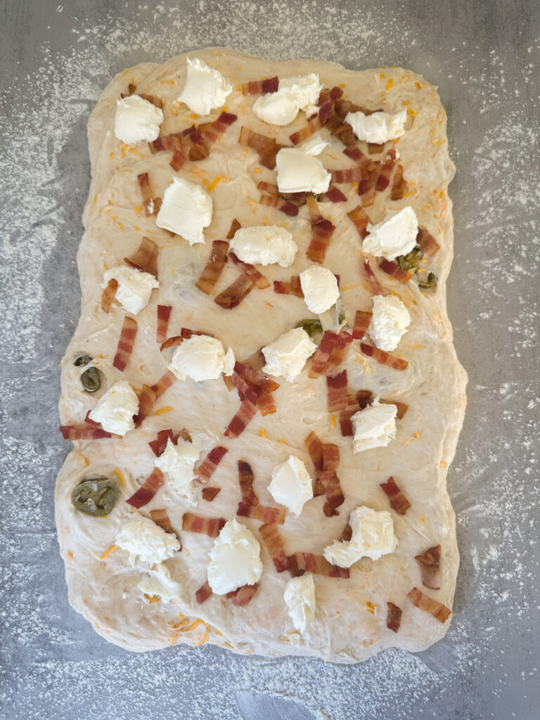 Add cream cheese in small spoonful's on top