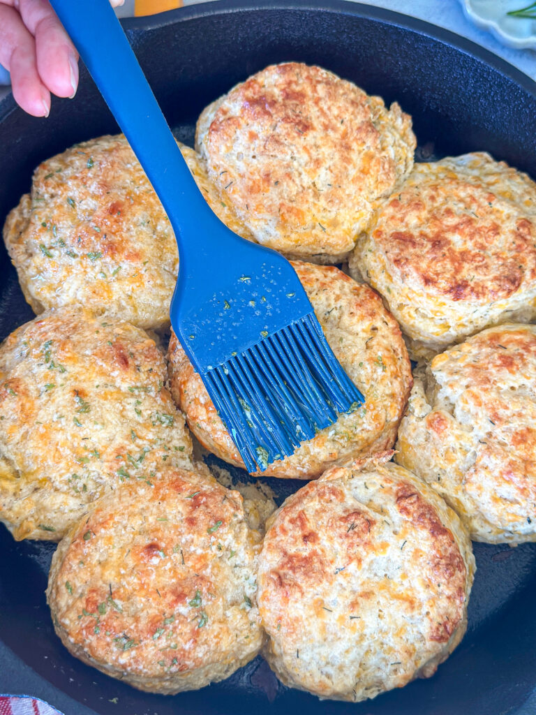 Brush tops of biscuits with butter