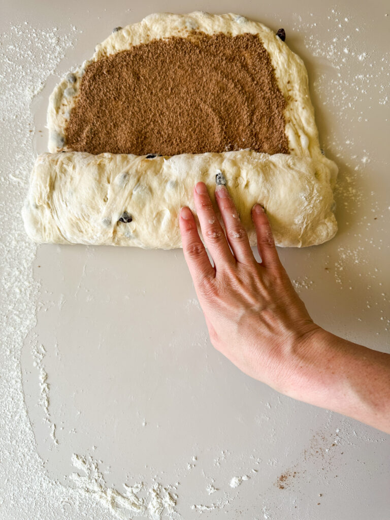 Starting at the bottom edge, roll up the loaf