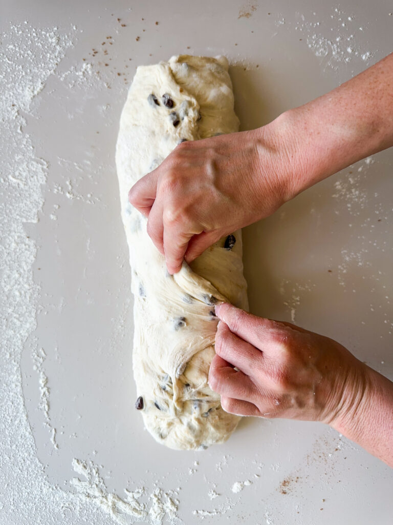 Pinch the seam together and form a log