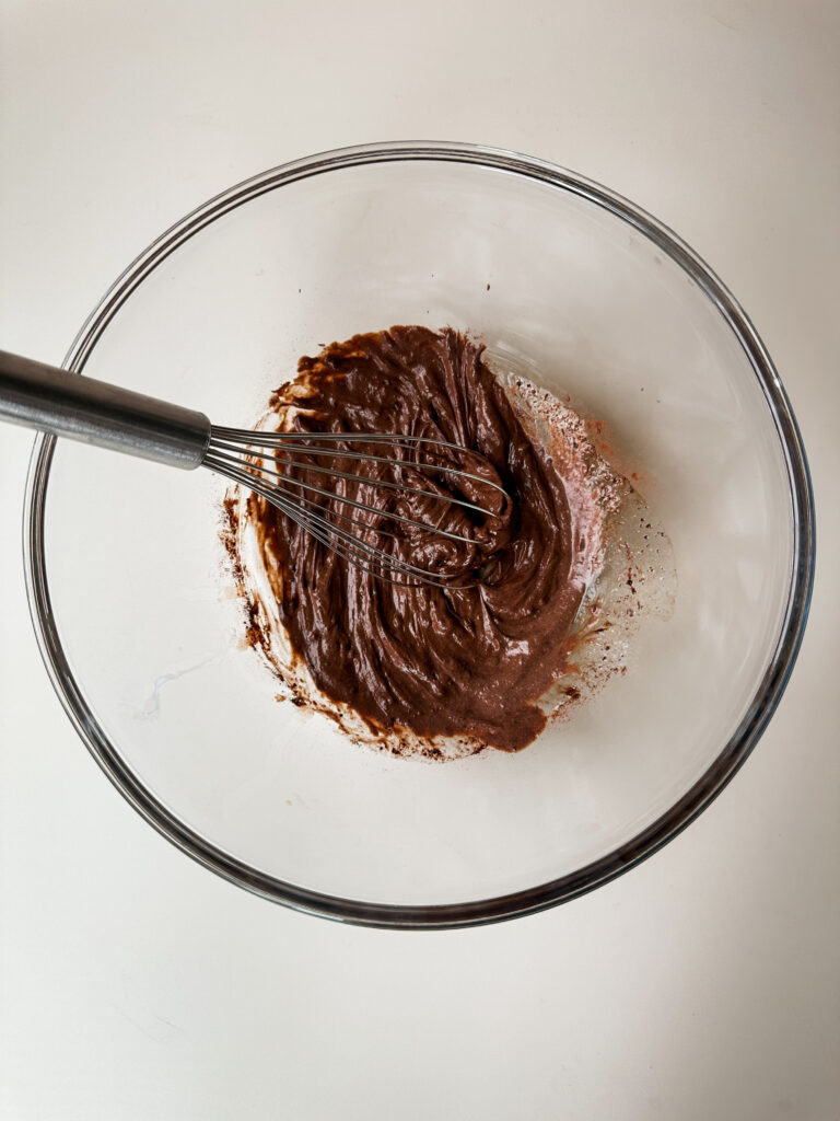 Whisk melted butter, cocoa, salt, vanilla, and cream