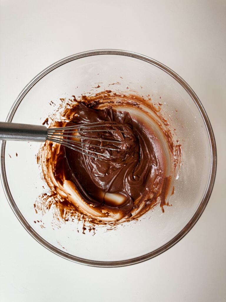 Add powdered sugar and beat until silky