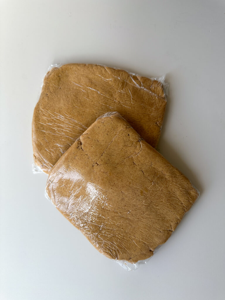 Divide in 2 and wrap in plastic; refrigerate 