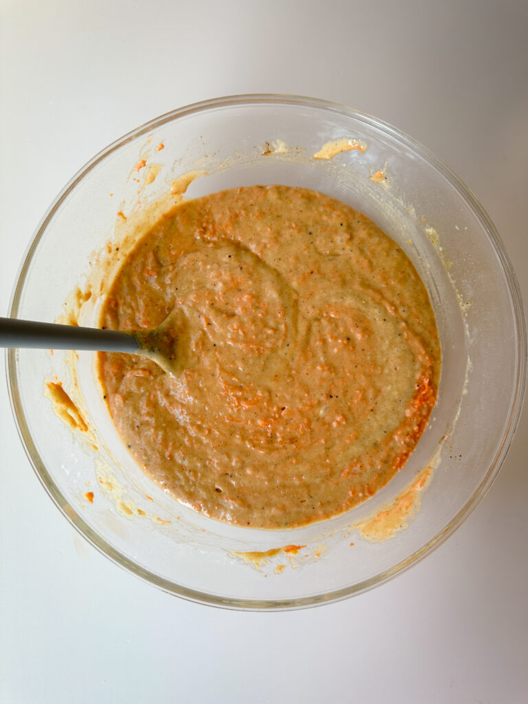 Fold in grated carrots and orange zest