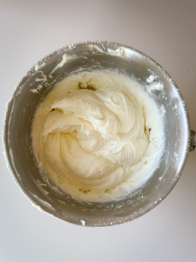 Add vanilla, salt, and powdered sugar and beat until fluffy 