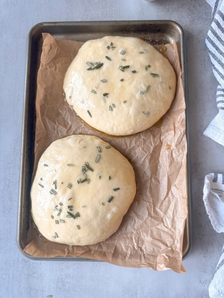 Brush loaves with oil and top with rosemary