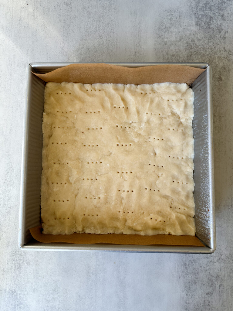 Press crust into pan and dock 