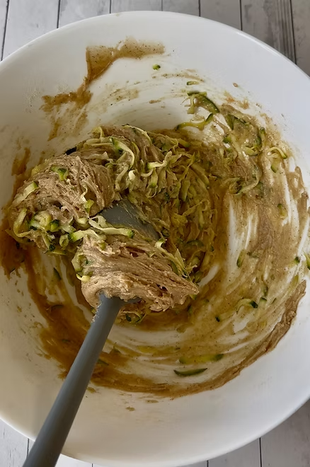Fold zucchini into batter