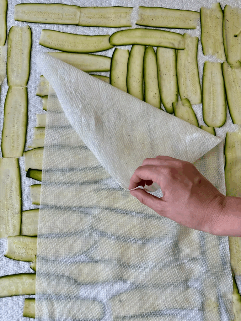 Slice zucchini very thin and " sweat with salt. Res, then blot moisture with paper towels. This step is critical to avoid watery lasagna.