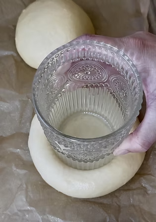 Use a grease cup to form deep wells in center of kolaches