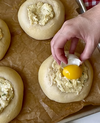 add an egg yolk to the center of the kolache