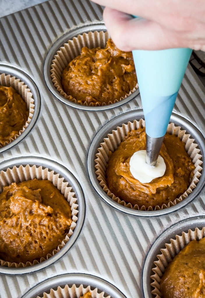 Fill center of muffin with cream cheese filling.