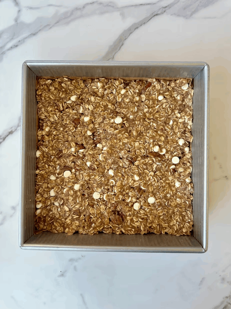 Combine protein bars and press into baking pan firmly.