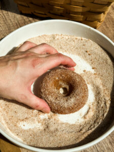 Coat both sides of the donut in cinnamon sugar