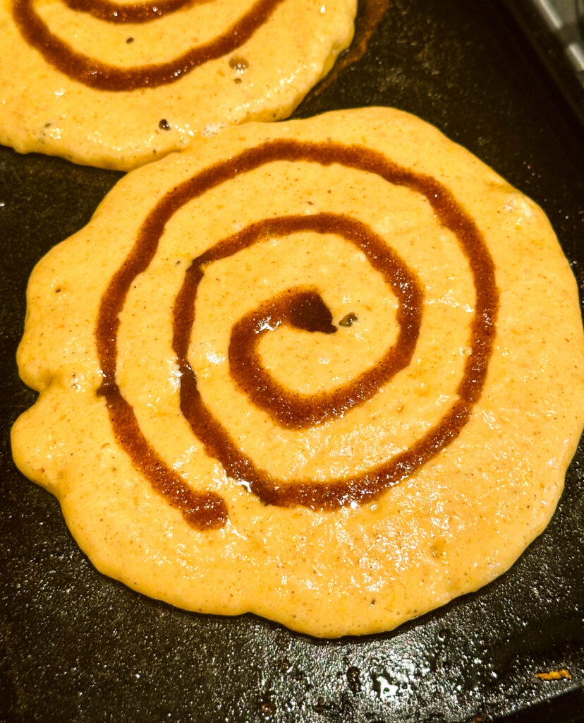 Pipe a swirl onto the top of the pancakes
