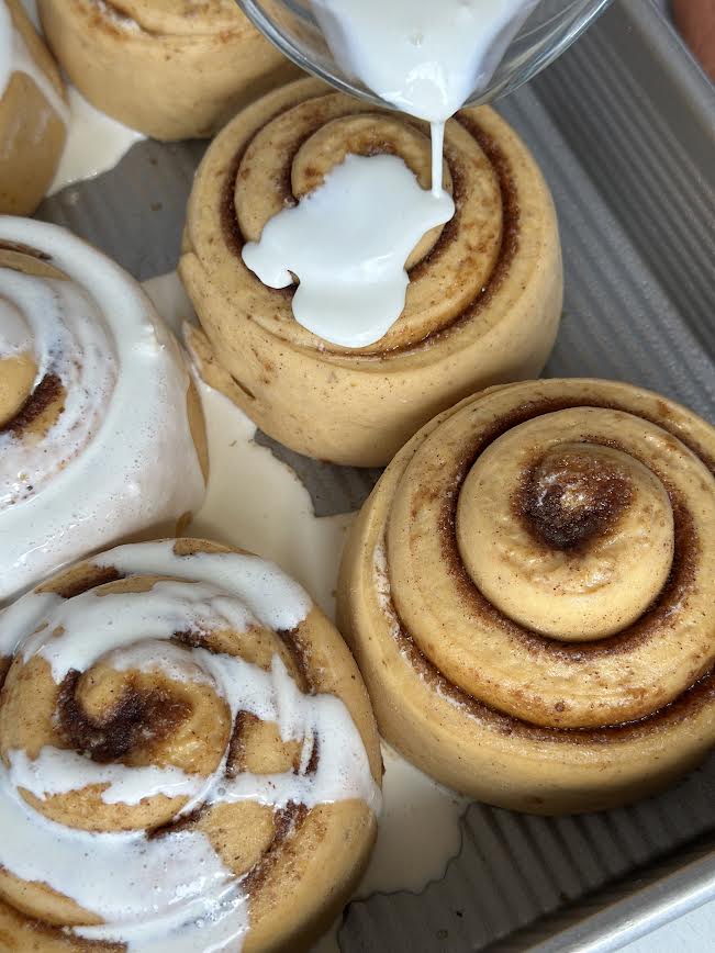 Pour cream over rolls right before baking.