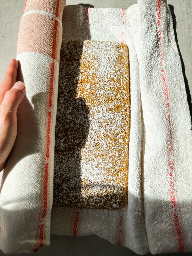 Roll the cake up into the towel