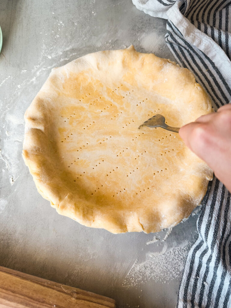 Dock the bottom and sides of the pie crust