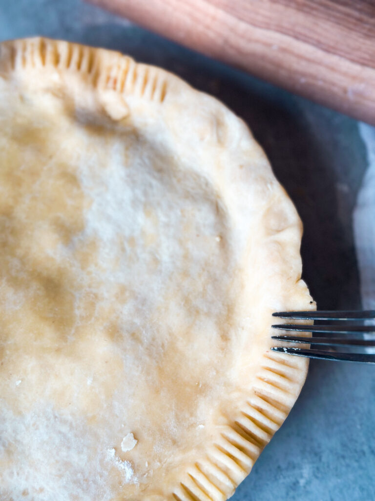 Seal the two crusts together crimping the edge with a fork
