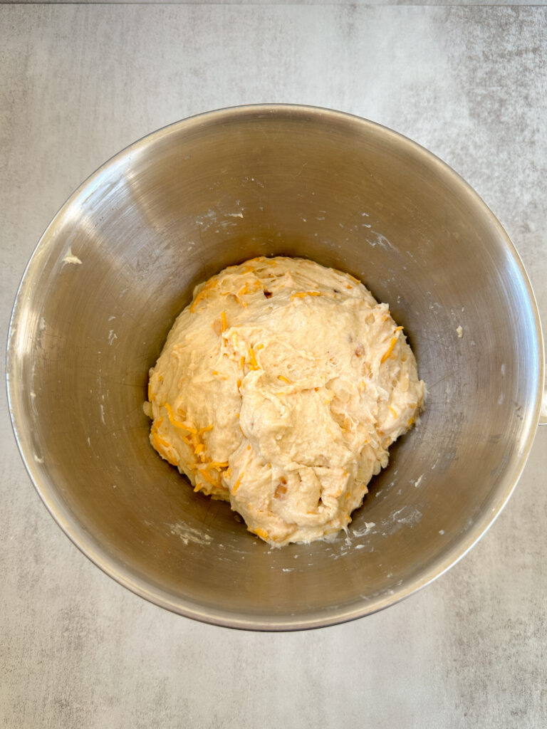 After dough rests, add cheese 