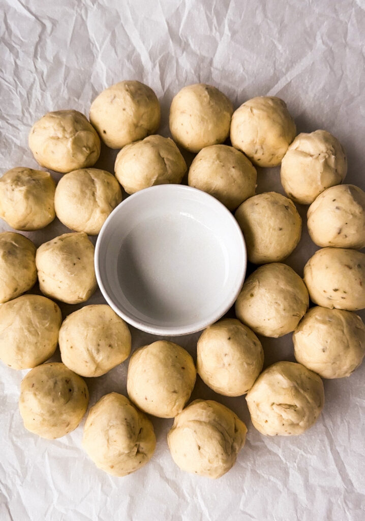 Arrange the balls to form the inner and outer circle of the wreath