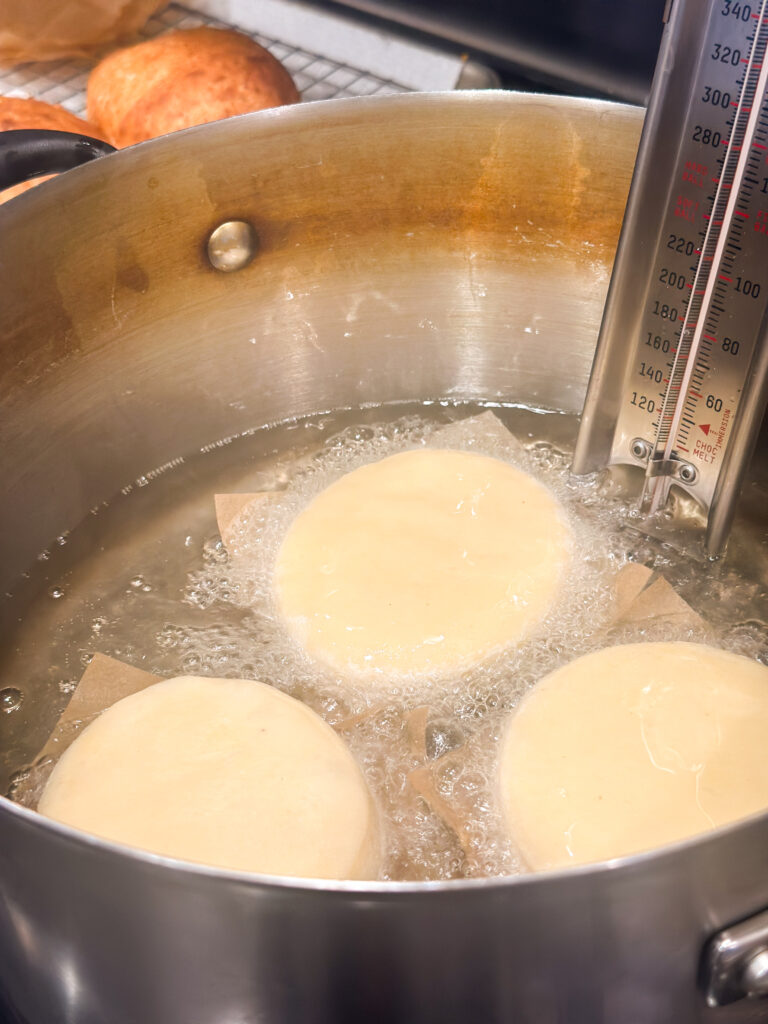 Transfer donuts to hot oil