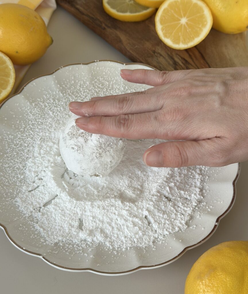 Then roll in sifted powdered sugar