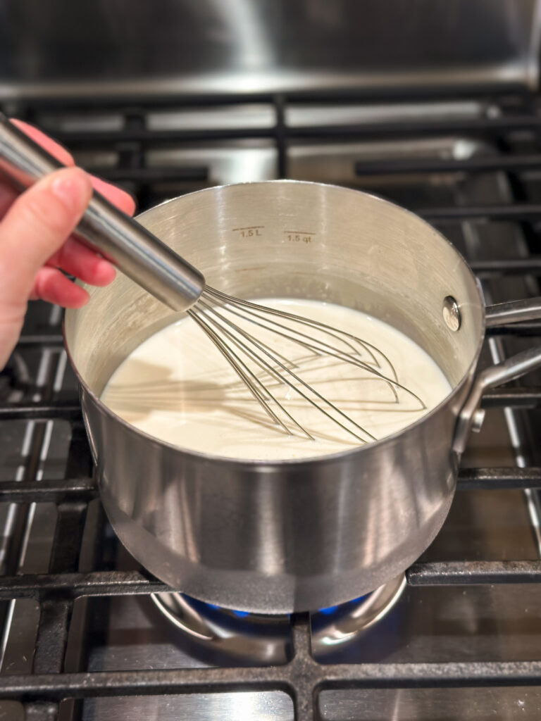 Heat milk and cream on low