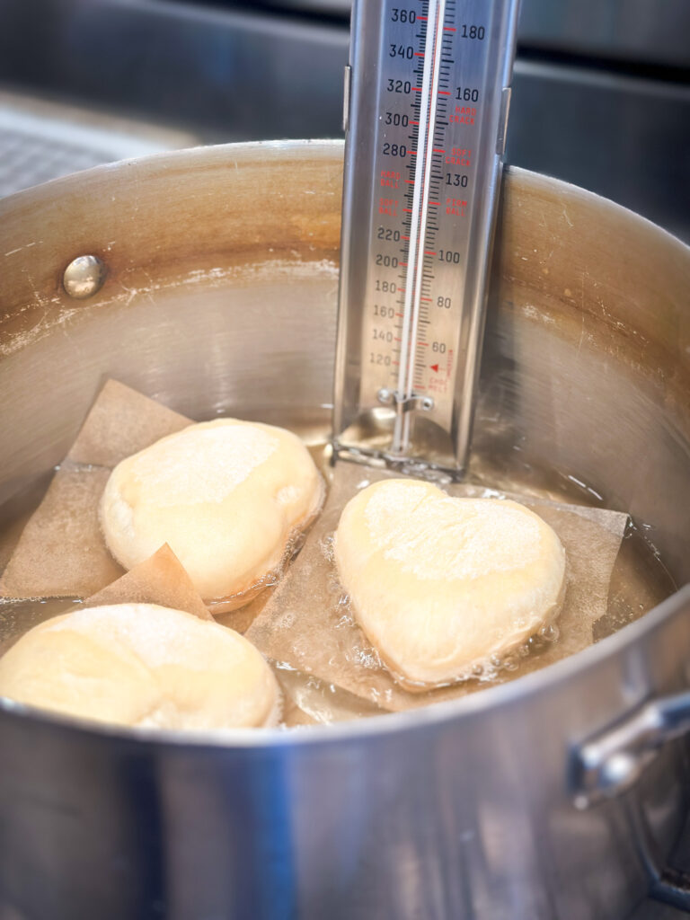 Transfer donuts to hot oil