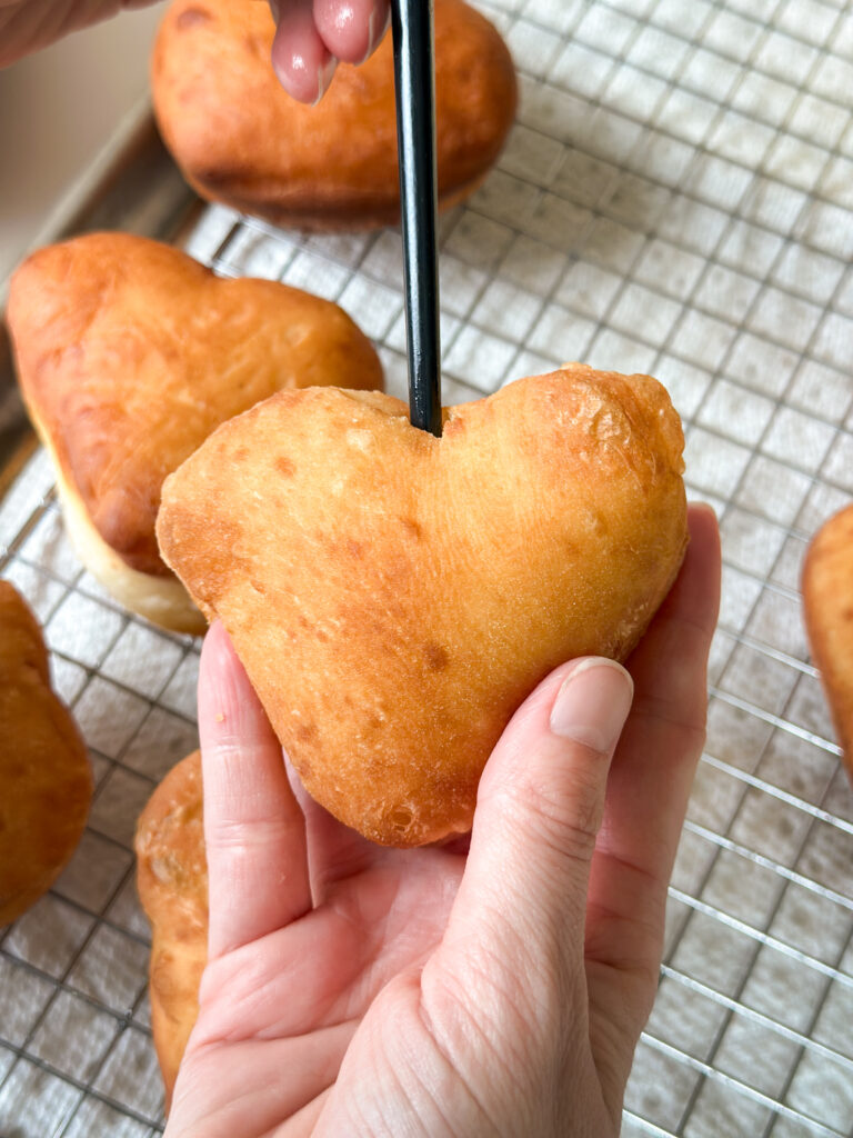 Poke a hole in the donut to create a cavity