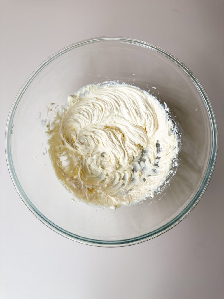 Combine cream cheese frosting