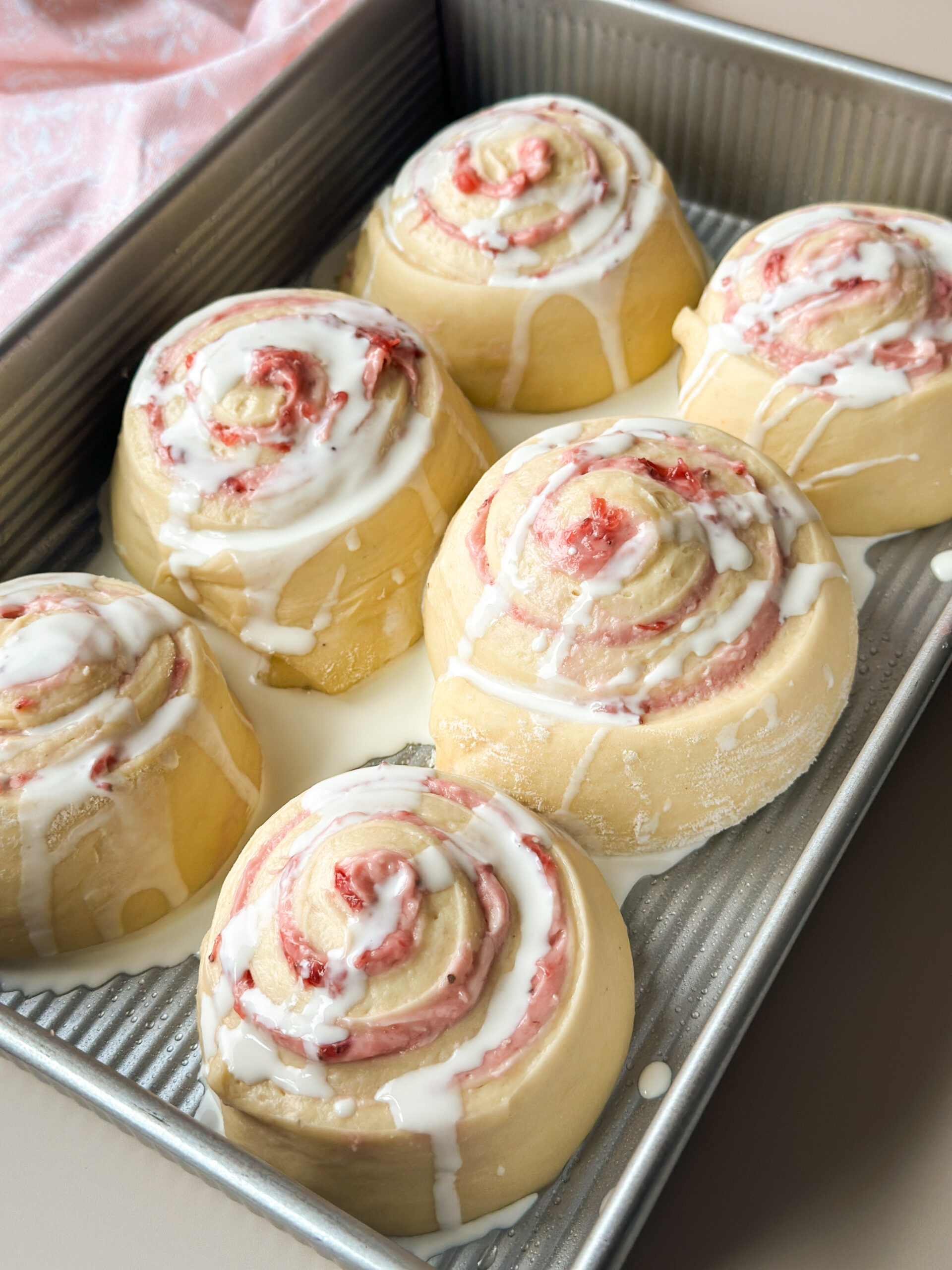 Pour cream over rolls right before baking.