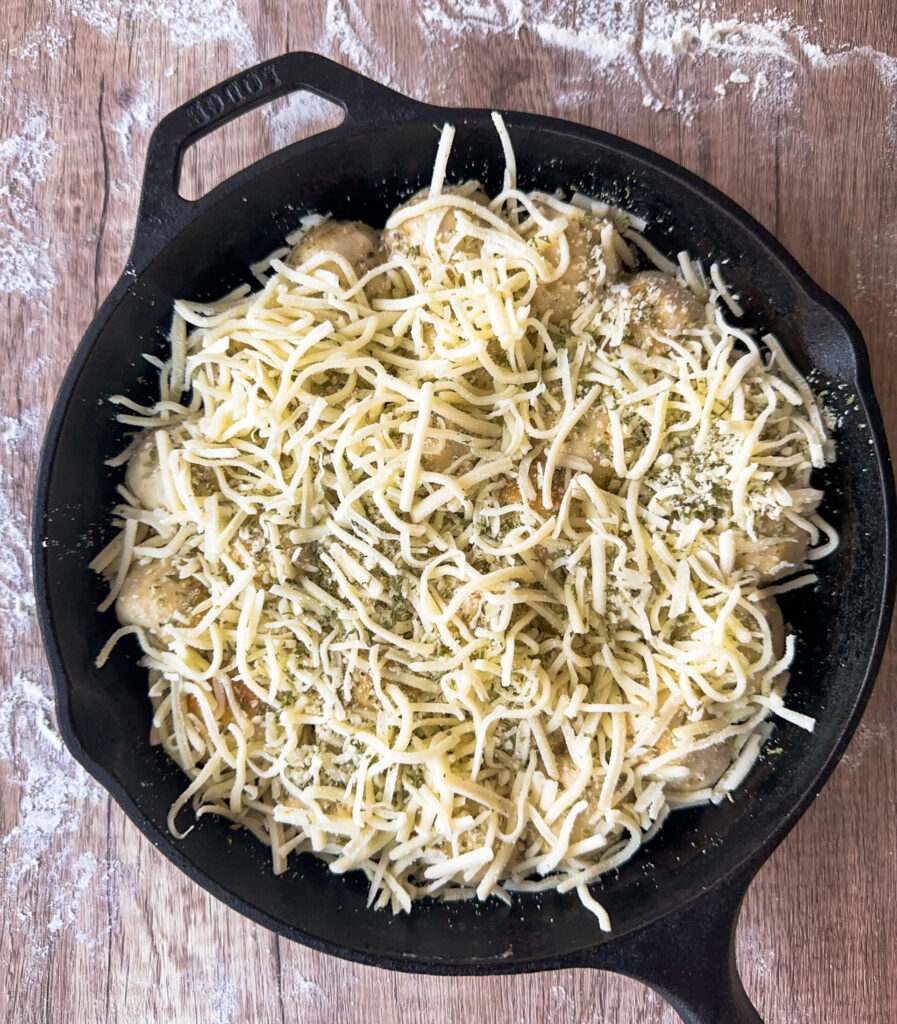 Top bites with garlic butter and cheese mix