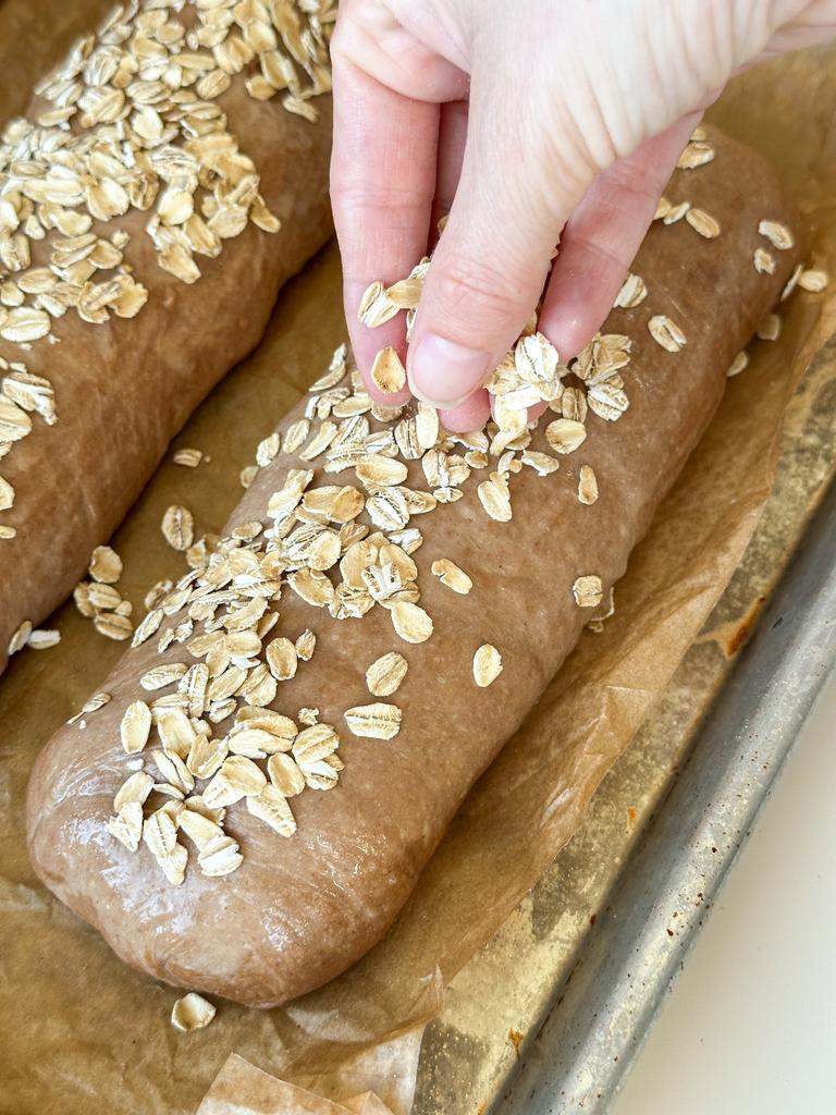 Sprinkle rolls with rolled oats