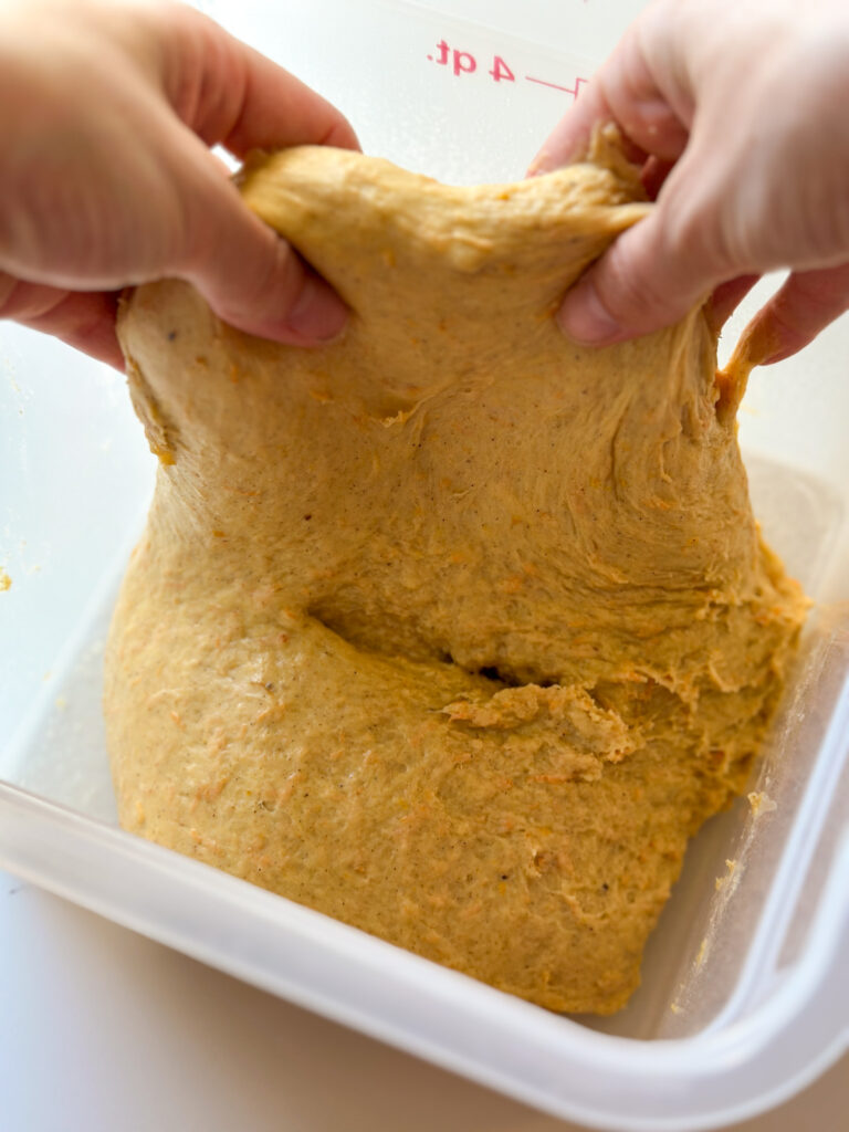 Dough should be tacky and smooth; it won't pass windowpane that's okay