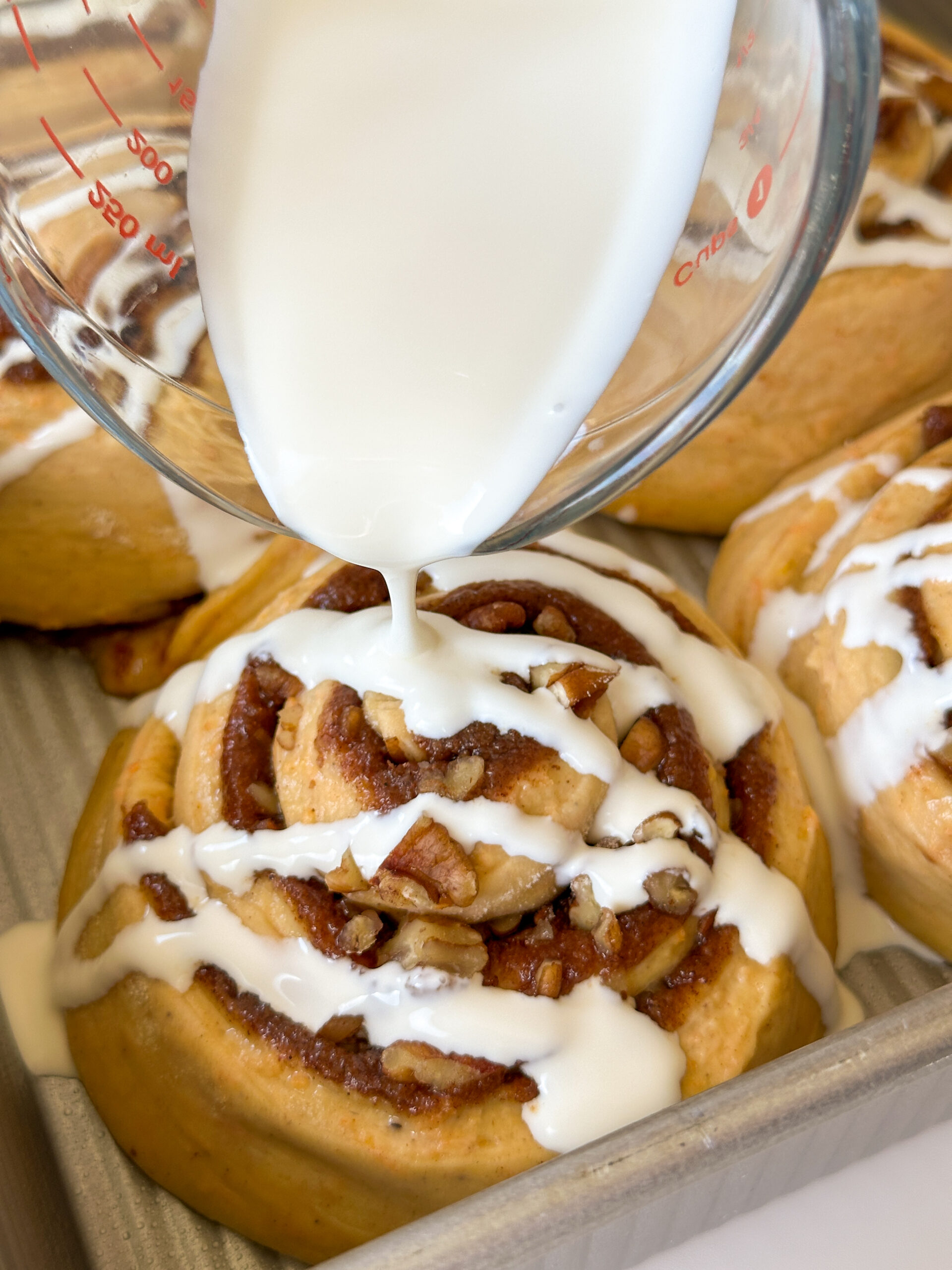 Pour cream over rolls right before baking.