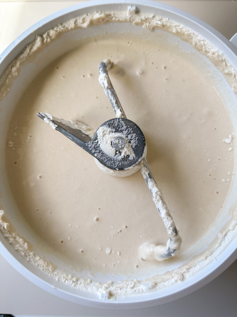 Add the starter, water, salt, and half the flour to the mixer and combine