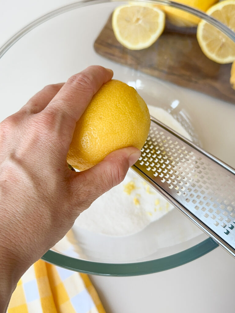 Zest the lemons into the white sugar
