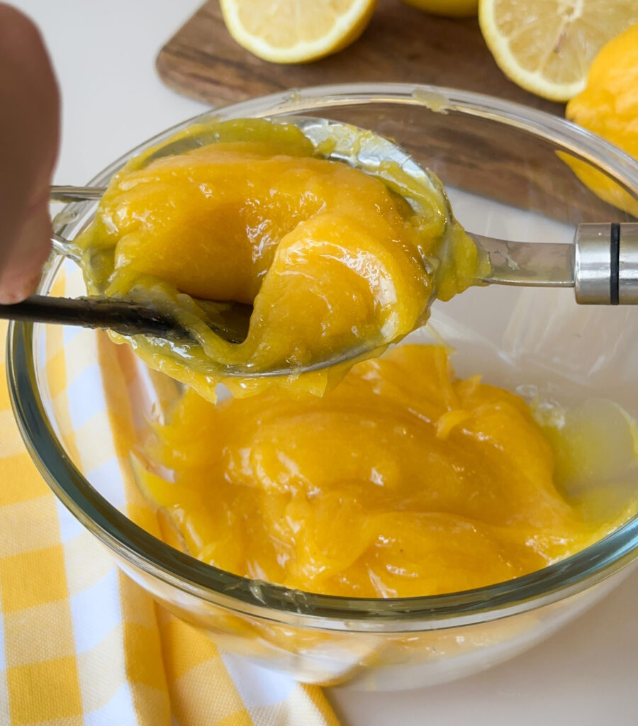 Press the curd through a sieve to strain any bit of egg or zest